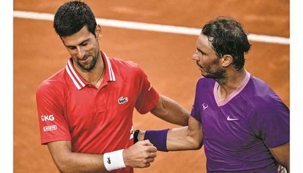 Spainu2019s Rafael Nadal (right) and Serbiau2019s Novak Djokovic greet each other after the former won the Italian Open final at Foro Italico in Rome, Italy, on Sunday. (AFP)