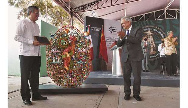 Chinese ambassador to Mexico Zhu Qingqiao and Mexican President Andres Manuel Lopez Obrador take part in an event where the Mexican government apologised for killing Chinese residents 110 years ago, in Torreon, in Coahuila state, yesterday.