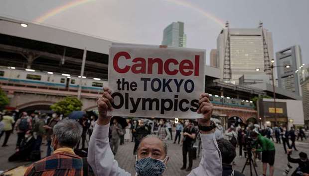 People take part in a protest against the hosting of the 2020 Tokyo Olympic Games in Tokyo