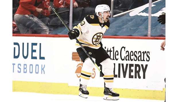 Brad Marchand of the Boston Bruins celebrates his game winning goal in overtime against the Washington Capitals in Game Two of the First Round of the 2021 Stanley Cup Playoffs at Capital One Arena in Washington, DC. (Getty Images/AFP)