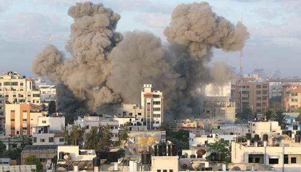 Smoke rises following an Israeli air strike on a building, amid a flare-up of Israeli-Palestinian fighting, in Gaza City