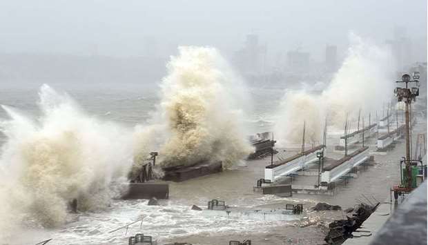 Waves lash over onto a shoreline in Mumbai as Cyclone Tauktae, packing ferocious winds and threatening a destructive storm, surge bore down on India