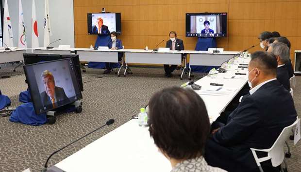International Olympic Committee (IOC) president Thomas Bach (on screen) delivers an opening speech at a meeting of the IOC Coordination Commission for the Tokyo 2020 Olympics, in Tokyo