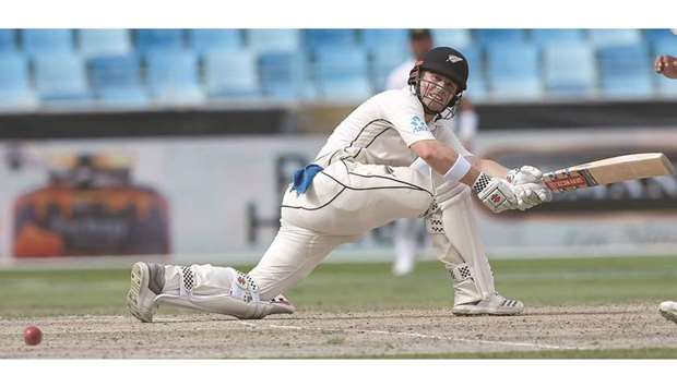 New Zealand batsman Henry Nicholls plays a shot during the fourth day of the second Test against Pakistan at the Dubai International Stadium in Dubai on November 27, 2018.