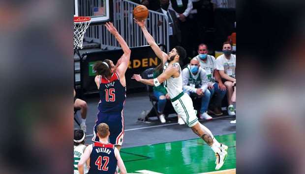 Boston Celtics forward Jayson Tatum (right) drives to the basket during the game against Washington Wizards at TD Garden in Boston, Massachusetts, United States, on Tuesday. (USA TODAY Sports)