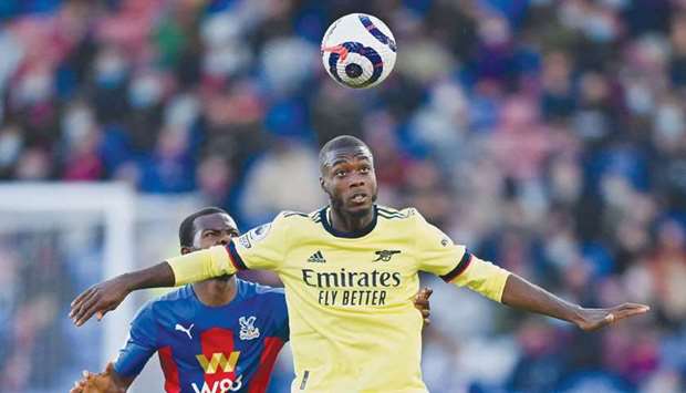 Arsenalu2019s Nicolas Pepe (right) in action during the Premier League match against Crystal Palace at Selhurst Park in London, England, on Wednesday. (AFP)