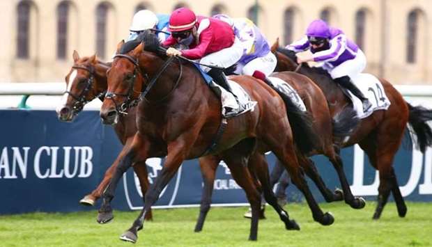 In this July 5, 2020, picture, Ioritz Mendizabal rides Mishriff to victory in the Prix du Jockey Club in Chantilly, France. (Scoopdyga)