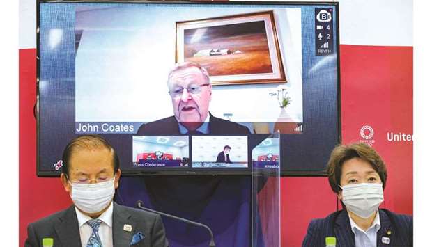 Tokyo 2020 CEO Toshiro Muto, Tokyo 2020 President Seiko  Hashimoto and IOC Co-ordination Commission Chairman John Coates (remotely on-screen) attend an International Olympic Committee (IOC) and Tokyo 2020 Olympic news conference in Tokyo yesterday.