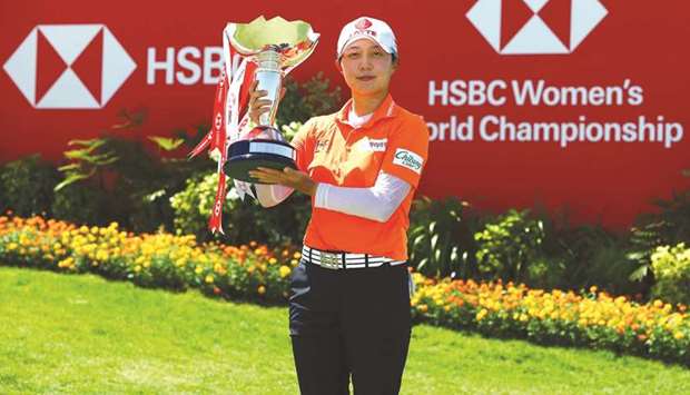 South Koreau2019s Kim Hyo-joo poses with the trophy after winning the HSBC Womenu2019s World Championship yesterday. ?(Twitter/HWWCGolf)