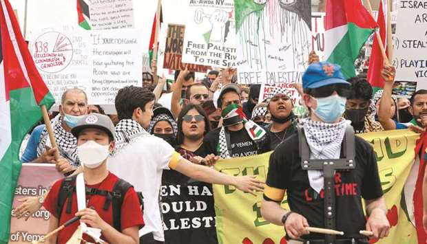 People take part in a rally in support of Palestinians, in the Queens borough of New York City, yesterday.