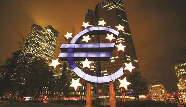 The euro sculpture illuminated outside the Eurotower, the former headquarters of the European Central Bank in Frankfurt. A battle is raging in Europeu2019s riskiest government-bond markets between fear that central bank support is waning and desire to snap up some of the regionu2019s most lucrative assets.