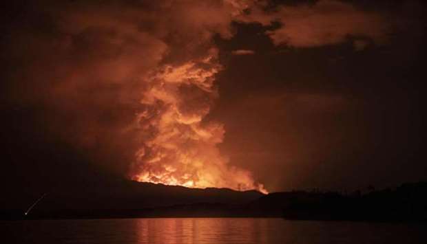 This general view taken yesterday from Tchegera Island outsoide Goma on the lake Kivu in the East of the Democratic Republic of Congo shows flame spewing from the Nyiragongo volcano.