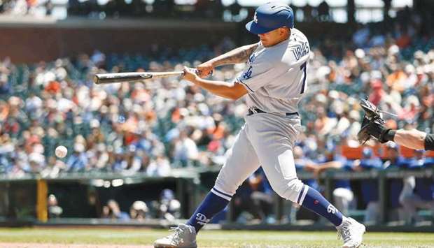 Starting pitcher Julio Urias of the Los Angeles Dodgers hits an RBI single in the top of the third inning against the San Francisco Giants at Oracle Park in San Francisco. (Getty Images/AFP)