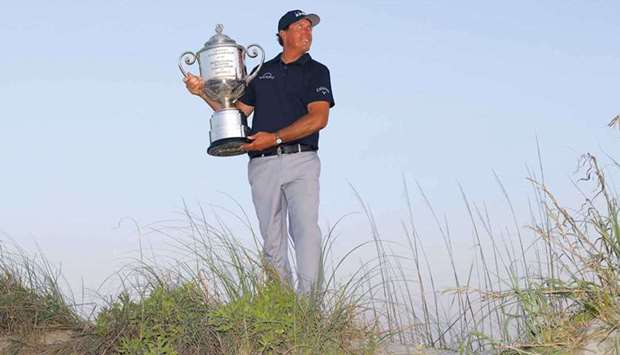 Phil Mickelson of the US celebrates with the Wanamaker Trophy after winning the PGA Championship in Kiawah Island, South Carolina, United States, on Sunday. (AFP)