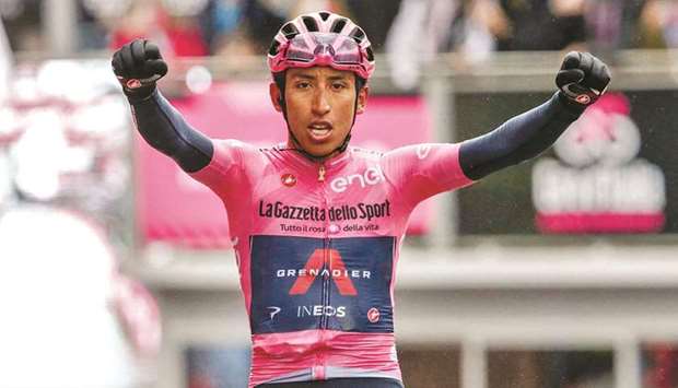 Overall leader Team Ineos rider Colombiau2019s Egan Bernal celebrates as he crosses the finish line to win the 16th stage of the Giro du2019Italia 2021 cycling race, 153km between Sacile and Cortina du2019Ampezzo, yesterday. (AFP)