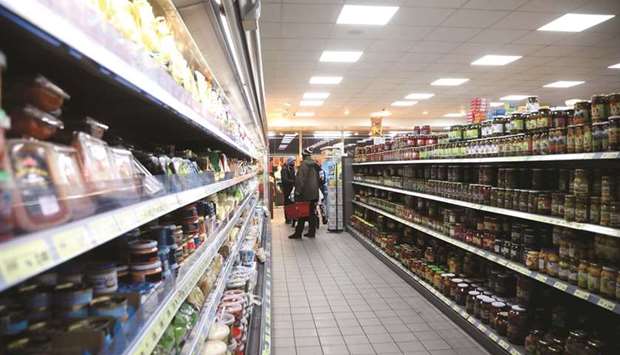 Customers browse food products in a supermarket aisle in Berlin. With many firms reporting a build-up of supply bottlenecks, yesterdayu2019s Ifo business climate index readout showed a jump to 99.2, up from Aprilu2019s revised 96.6 and beating the 98.2 forecast in a Reuters poll of analysts.