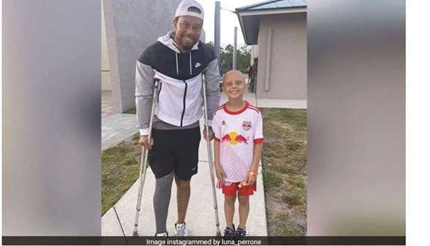Tiger Woods with 10-year-old Luna Perrone, a Florida girl who is fighting cancer posted a photo of herself with the golf superstar on her Instagram.
