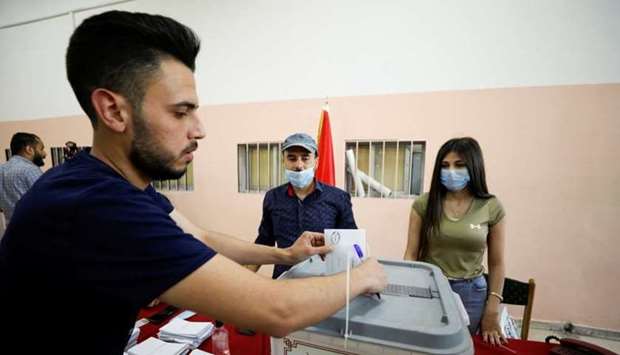 A man casts his vote during the presidential elections at a polling centre in Damascus, Syria