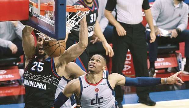 Ben Simmons of the Philadelphia 76ers dunks over Russell Westbrook of the Washington Wizards during Game Two of the Eastern Conference first round series at Wells Fargo Center in Philadelphia, Pennsylvania. (Getty Images/AFP)