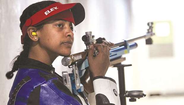 Luna Solomon of Eritrea, hoping to make the Refugee Olympic Team in the 10m air rifle competition, pauses during a training session in Lausanne, Switzerland.