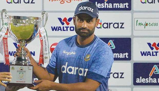 Bangladeshu2019s captain Tamim Iqbal holds the series trophy after the third and final One-Day International (ODI) against Sri Lanka at Sher-e-Bangla National Cricket Stadium in Dhaka yesterday. The hosts won the series 2-1.