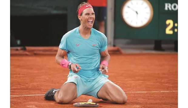 In this October 11, 2020, picture, Spainu2019s Rafael Nadal celebrates after winning the French Open final against Serbiau2019s Novak Djokovic (not pictured) at Roland Garros in Paris, France. (Reuters)