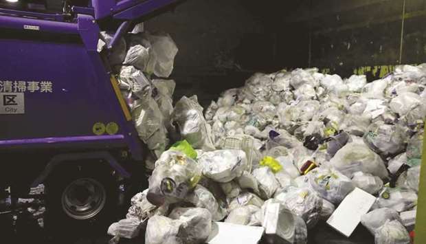 A truck unloads plastic waste for recycling at Minato Resource Recycle Center in Tokyo, Japan, on June 10, 2019. (Reuters)