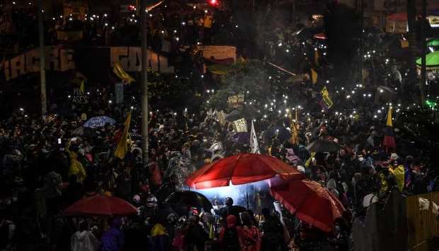 Demonstrators take part in a protest against the government of Colombian President Ivan Duque, at the Portal De Las Americas terminus station, in Bogota yesterday. AFP