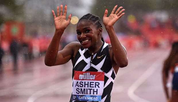 Britain's Dina Asher-Smith celebrates after winning the women's 100m final during the Diamond League athletics meeting at Gateshead International Stadium in Gateshead, north-east England on May 23, 2021.