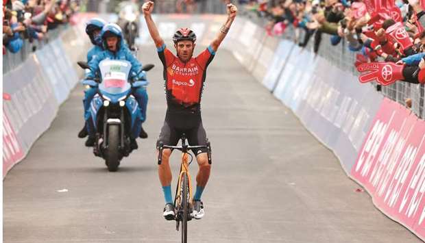 Team Bahrain rider Italyu2019s Damiano Caruso celebrates as he crosses the finish line to win the 20th stage of the Giro du2019Italia 2021 cycling race, 164km between  Verbania and Valle Spluga, Alpe Motta (Madesimo), yesterday. (AFP)