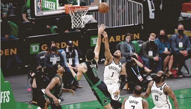 Boston Celtics forward Jayson Tatum shoots the ball over Brooklyn Nets forward Bruce Brown during the second half of game three in the first round of the 2021 NBA Playoffs at TD Garden. (USA TODAY Sports)
