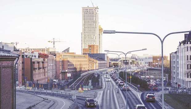 Automobiles stand in traffic on a street in Helsinki. MaaS Global, whose investors include BP Plc, Mitsubishi Corp and Toyota Financial Services, says its app can fix urban congestion and reduce pollution.