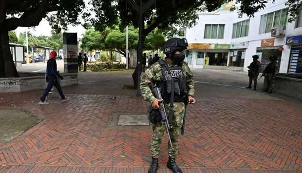 A Colombian soldier stands guard in a street the day after protests against the Colombian President Ivan Duque's government, in Cali, Colombia on May 29.