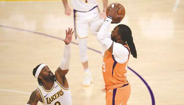 Phoenix Suns forward Jae Crowder shoots a three point basket against the defense of Los Angeles Lakers guard Wesley Matthews during the first half in game four of the first round of the 2021 NBA Playoffs at the Staples Center in Los Angeles. (USA TODAY Sports)