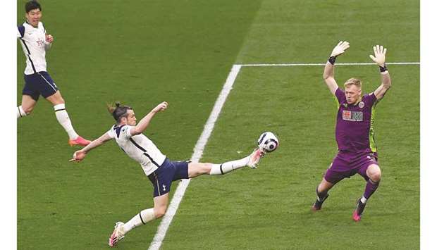 Tottenham Hotspuru2019s Gareth Bale (centre) scores against Sheffield United on Sunday. (AFP)