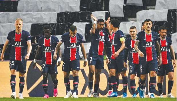 File photo of PSG players celebrating after scoring a goal during the UEFA Champions League first leg semi-final match against Manchester City at the Parc des Princes stadium in Paris on April 28, 2021.