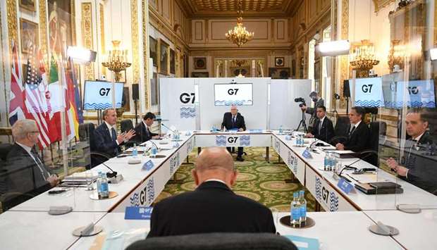 (from L) Canada's Foreign Affairs Minister Marc Garneau, Britain's Foreign Secretary Dominic Raab, (5L), Japan's Foreign Minister Toshimitsu Motegi, European High Representative of the Union for Foreign Affairs Josep Borrell, Italy's Foreign Minister Luigi Di Maio, US Secretary of State Antony Blinken, Germany's Foreign Affairs Minister Heiko Maas and France's Foreign Affairs Minister Jean-Yves Le Drian (front) gesture during talks at the start of the G7 foreign ministers meeting in London