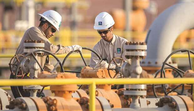 The handout picture provided by Aramco on December 19, 2016, shows its engineers working in eastern Saudi Arabia. Aramco said its net profit rose to $21.7bn in the first three months of the year, compared to $16.7bn in the same quarter of 2020, owing to a stronger oil market and higher refining and chemicals margins.