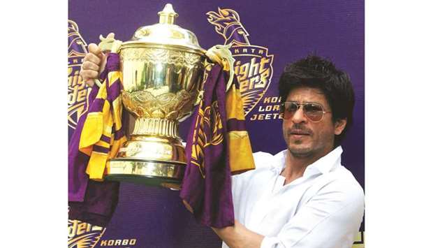 (File photo) Bollywood actor Shah Rukh Khan displays the Indian Premier League (IPL) cricket trophy during a news conference at his residence in Mumbai, May 30, 2012. Khanu2019s Kolkata Knight Riders team won the 2012 IPL after defeating Chennai Super Kings.