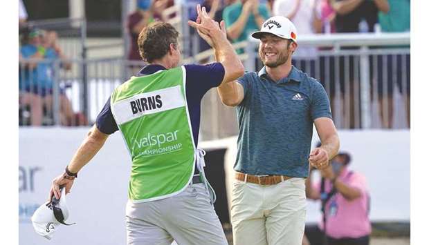 Sam Burns celebrates with his caddie Travis Perkins after winning the Valspar  Championship at the Palm Harbor, Florida, USA. (USA TODAY Sports)