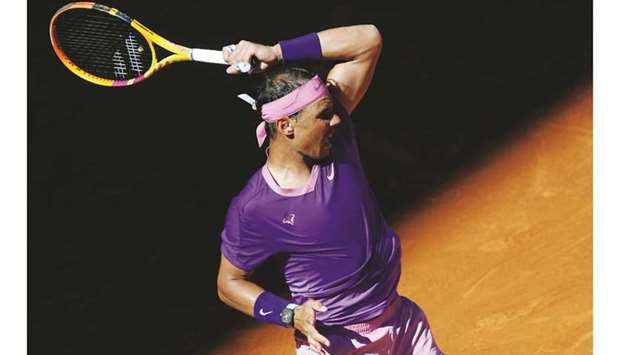 Spainu2019s Rafael Nadal returns the ball to compatriot Carlos Alcaraz (not pictured) at the Madrid Open yesterday. (AFP)