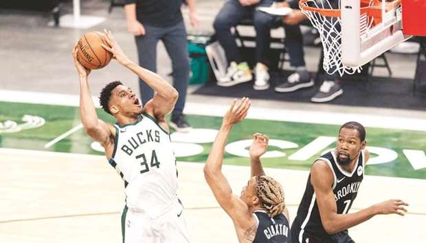Milwaukee Bucks forward Giannis Antetokounmpo shoots over Brooklyn Nets forward Nicolas Claxton (right) during the second quarter at Fiserv Forum in Milwaukee, Wisconsin, USA. (USA TODAY Sports)