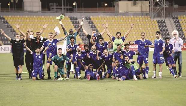 Al Khor players and support staff celebrate after their win over Al Shahania in the play-off at the Suhaim Bin Hamad Stadium on Tuesday night.