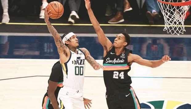 Utah Jazz guard Jordan Clarkson attempts a shot while San Antonio Spurs guard Devin Vassell tries for the block during the fourth quarter at Vivint Arena in Salt Lake City. (USA TODAY Sports)