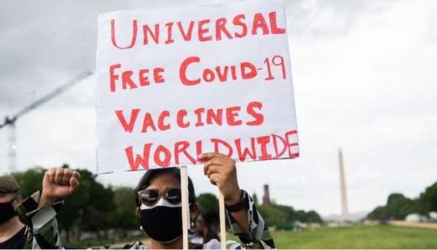 Demonstrators hold a rally to u201cFree the Vaccine,u201d calling on the US to commit to a global coronavirus vaccination plan that includes sharing vaccine formulas with the world in Washington on May 5, 2021..(AFP)