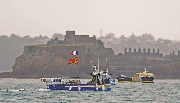French fishing boats are seen near the port of Saint Helier, off the British island of Jersey, to draw attention to what they see as unfair restrictions on their ability to fish in UK waters after Brexit.