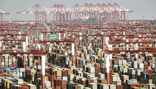 Shipping containers next to gantry cranes at the Yangshan Deepwater Port in Shanghai. Chinau2019s exports rose more than expected in April, suggesting its trade out-performance could last longer than expected this year, fuelled by global fiscal stimulus.