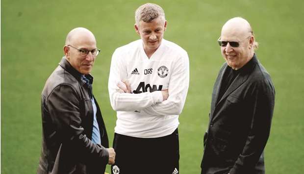 In this April 15, 2019 file photo, Manchester United manager Ole Gunnar Solskjaer (centre) with clubu2019s co-owners Joel Glazer (left) and Avram Glazer. (Reuters)