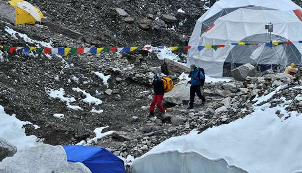 Expedition members wearing facemask arrive at Everest base camp, some 140 Km northeast of Kathmandu.