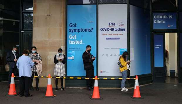 People wait in line at a coronavirus disease (Covid-19) testing clinic in the city centre after new cases were reported in Sydney, Australia